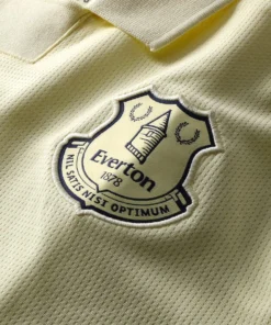 Close-up of the Everton club crest on the Away Kit 25/26 by Castore in pastel yellow.
