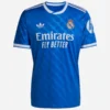 Adidas Real Madrid 25/26 Third Kit, blue jersey with white logos, short sleeves, crewneck collar, front view.