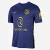 Nike Atletico Madrid Away Kit 25/26, front view, navy base, lightning bolt graphics, crewneck, short sleeves.