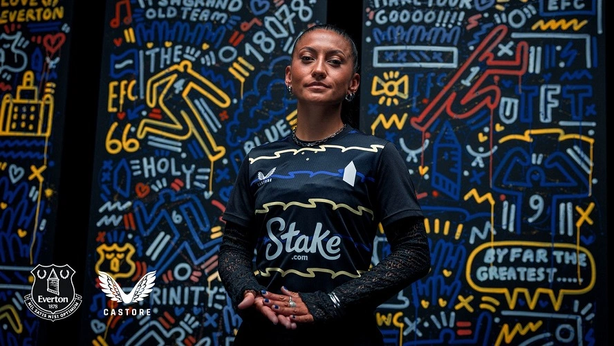 Everton Third Kit 25/26 in black with blue and yellow zig-zag pattern and club crest.