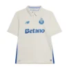Front view of the FC Porto Third Kit 25/26 in off-white with metallic blue details, short sleeves, and polo collar.