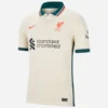 Front view of Nike Liverpool Away Kit 21/22 in stone white with dark teal polo collar and short sleeves.