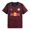 PUMA RB Leipzig Third Kit 25/26, front view, black base with red graphics, crewneck collar, short sleeves.
