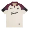 NOCTA Venezia Away Kit 25/26 in cream with burgundy and black details, retro football collar, short sleeves, front view.