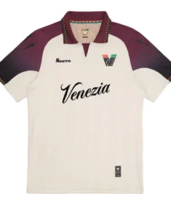 NOCTA Venezia Away Kit 25/26 in cream with burgundy and black details, retro football collar, short sleeves, front view.