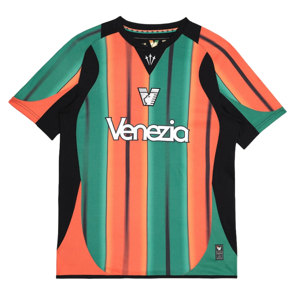 NOCTA Venezia Third Kit 25/26, orange and green stripes, V-neck collar, short sleeves, front view.