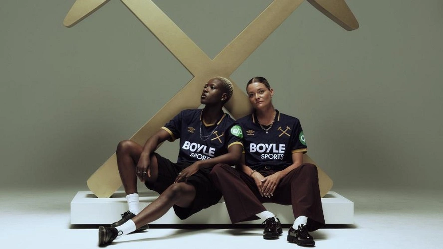 West Ham United Third Kit 25/26 in navy with gold details and crossed hammers crest.