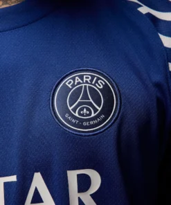 Close-up of Paris Saint-Germain crest on the Nike PSG Fourth Jersey 24/25.