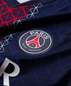 Close-up of Paris Saint-Germain badge on the Nike PSG Home Kit 25/26.