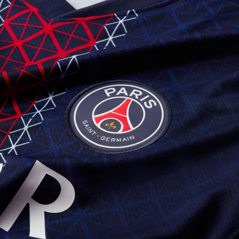 Close-up of Paris Saint-Germain badge on the Nike PSG Home Kit 25/26.