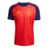 Adidas Spain Home Kit 2026, front view, red base with yellow and navy accents, crewneck, short sleeves.