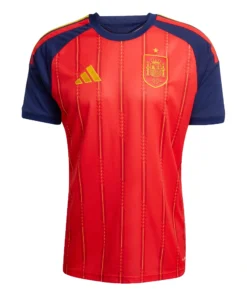 Adidas Spain Home Kit 2026, front view, red base with yellow and navy accents, crewneck, short sleeves.