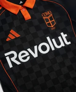 Zoomed view of Adidas Como Third Kit 25/26 in deep black, front detail showing subtle checkerboard jacquard.