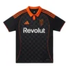 Adidas Como 1907 Third Kit 25/26, deep black with striking orange collar and short sleeves, front view.