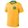 Australia Home Kit 2026 by Nike, front view in golden yellow with green accents, V-neck and short sleeves.