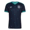 Germany Away Kit 2026, front view, deep blue design with light blue 90s-style details, V-neck collar, short sleeves.