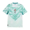 Front view of Portugal Away Kit 2026 by PUMA, white with lagoon green wave patterns, V-neck, central crest, short sleeves.