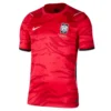 Nike South Korea Home Kit 2026, front view, red design, national crest, black sleeve cuffs, V-notch collar, short sleeves