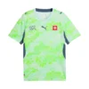 Front view of Switzerland Away Kit 2026 by PUMA, white and turquoise with indigo accents, crewneck, water network graphic.