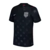 Nike USA Away Jersey 2026, front view with dark base and stars-inspired design, cross-over ribbed collar, short sleeves.