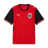 Front view of Austria Home Kit 2026 by PUMA, vibrant bright red, black crewneck, short sleeves.
