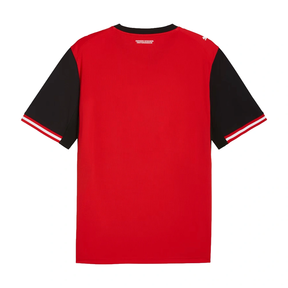 Back view of PUMA Austria Home Kit 2026, bright red with Immer wieder Österreich slogan, blank back.