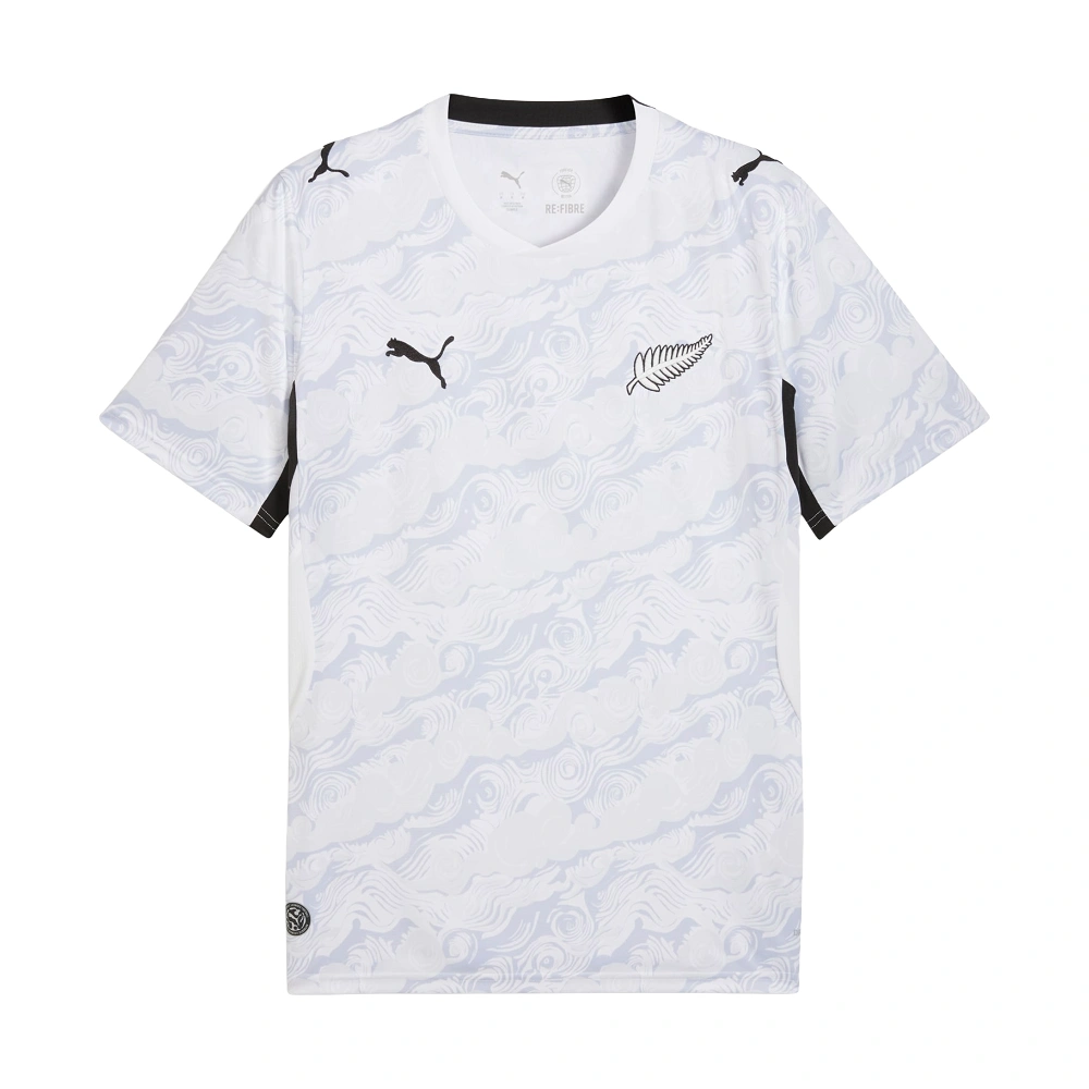 Front view of New Zealand Away Kit 2026 by PUMA, white base, sweeping graphic, black side panels, short sleeves.