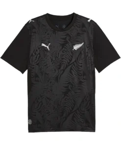 Front view New Zealand Home Kit 2026 by PUMA. Black base, silver fern pattern, short sleeves.