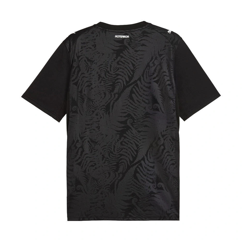 Back of New Zealand 2026 World Cup Home Kit. Black PUMA jersey, blank back with AOTEAROA neck detail.