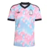 Adidas Belgium Away Kit 2026, front view, pastel pink and blue pattern with striking black V-neck and cuffs, short sleeves.