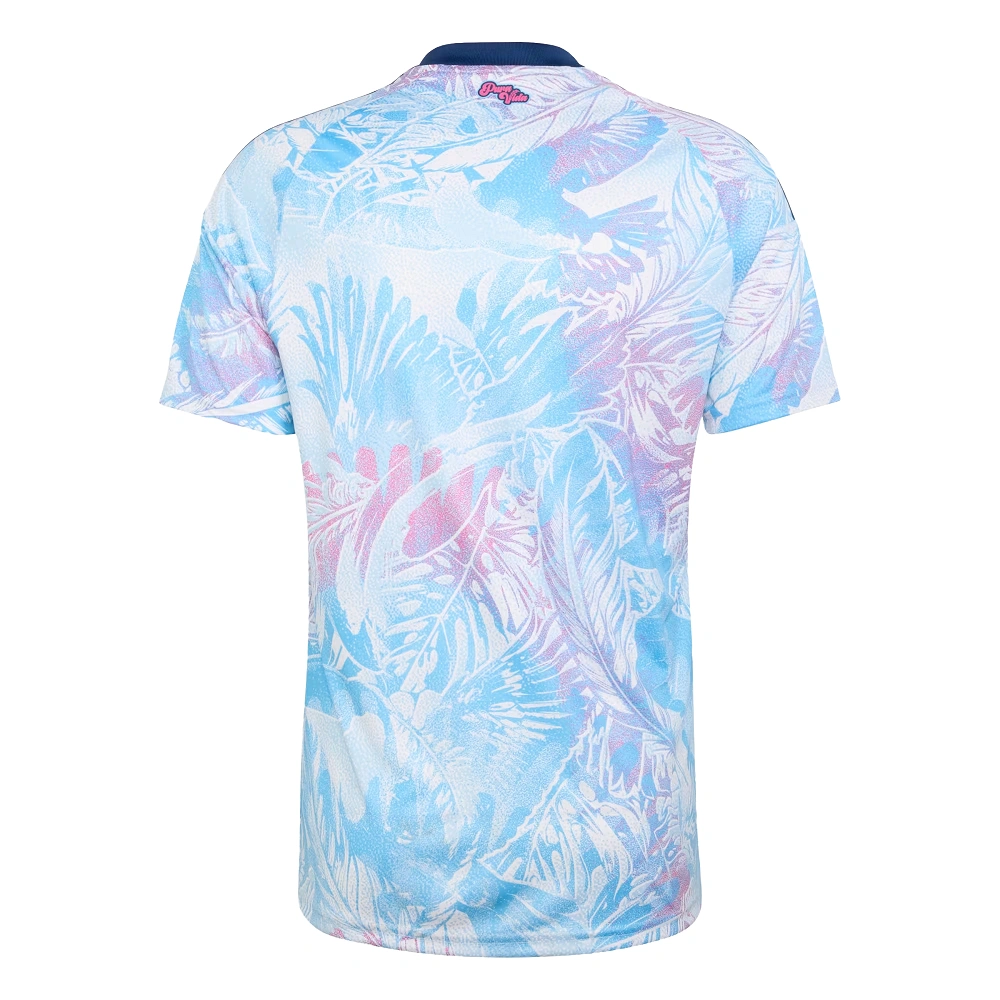 Costa Rica Away Jersey 2026 by adidas, back view. Features a tropical pattern, navy collar, and pink Pura Vida graphic. No name/number.