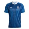 Front view of Greece Away Kit 2026 showing the deep blue base, vintage vertical stripes, and white accents.