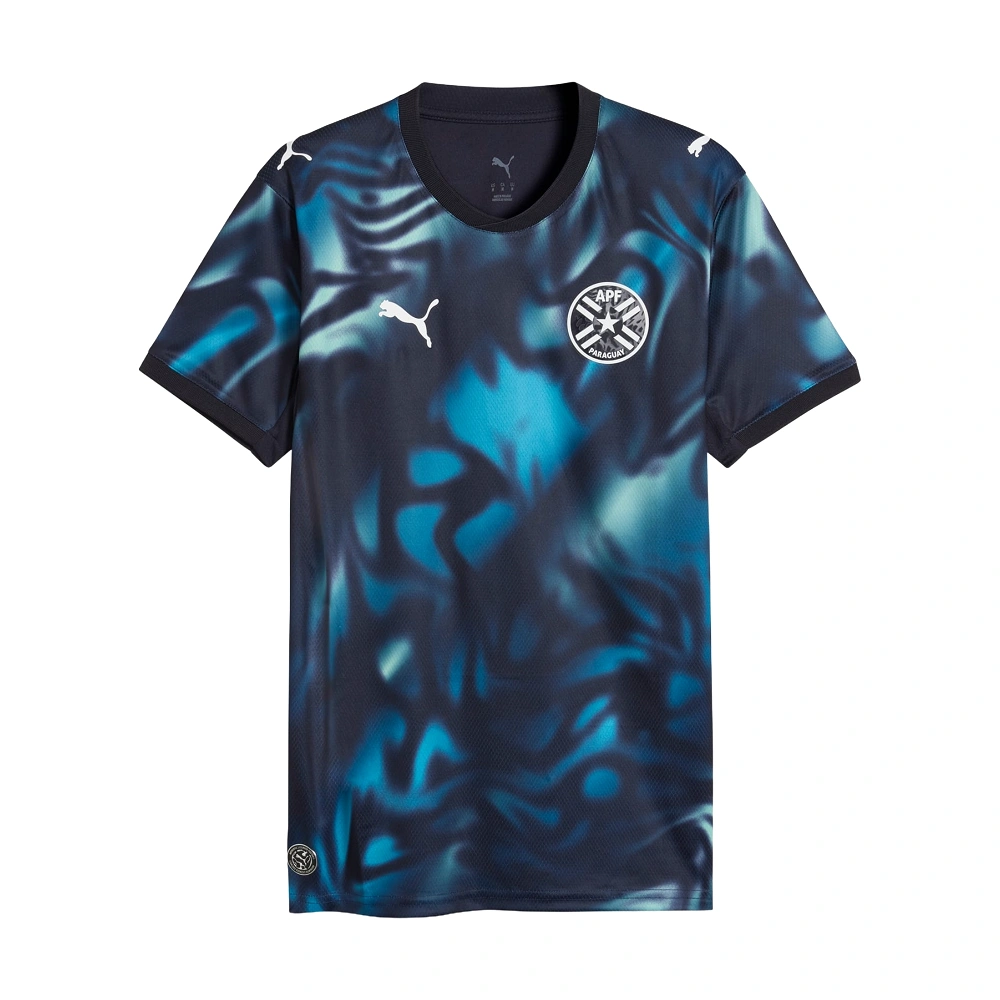 Front view of Paraguay Away Jersey 2026 by PUMA, deep navy with tropical blue print, V-neck, short sleeves.