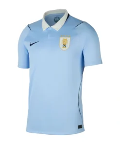 Uruguay Home Jersey 2026, front view, classic sky blue base featuring a crisp white and navy polo collar.
