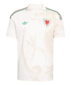 Adidas Wales Away Kit 2026, front view, cream base with stylized dragon pattern, polo collar, short sleeves.