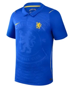 Chelsea Away Kit 26/27, front view, striking blue design, Midwest Gold lion crest, Nike swoosh, and tailored polo collar.