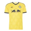 Leeds United Away Kit 26/27, front view, yellow base with navy and white accents, adidas Trefoil logo, retro rose crest.