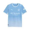 Front view of the Puma Manchester City Home Kit 26/27 in sky blue gradient with metallic chest crest and sponsor. 