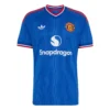 Manchester United Away Kit 26/27, front view, royal blue design, red and white trim, adidas Trefoil logo, and v-neck collar.