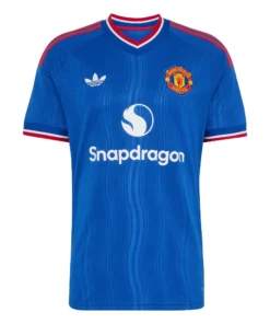 Manchester United Away Kit 26/27, front view, royal blue design, red and white trim, adidas Trefoil logo, and v-neck collar.